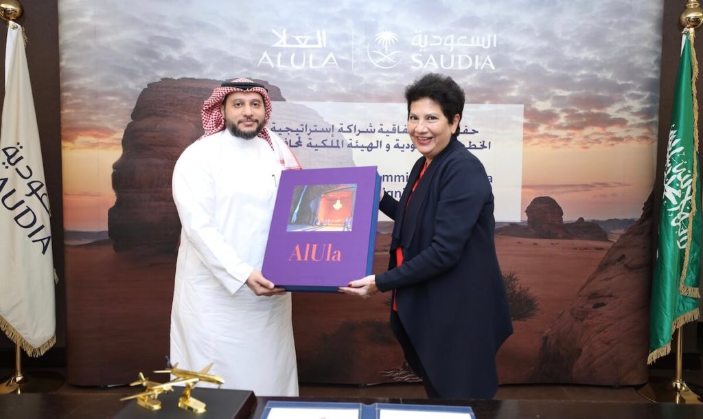 3- Ms. Melanie De Souza (RCU) and Mr. Hazem Sonbol (SAUDIA) exchanging gifts during the partnership signing ceremony on 26 January 2021 - 2