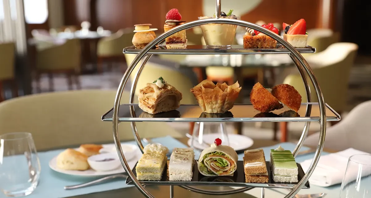 Indulge in the Finest British Tradition with Afternoon Tea on the Queen Elizabeth 2